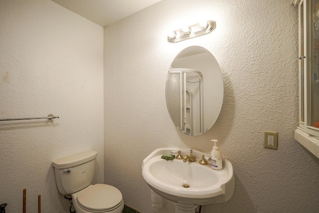 bathroom with toilet and sink