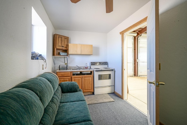 kitchen with light carpet, sink, ceiling fan, and white electric range oven