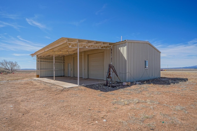 view of outbuilding featuring a garage