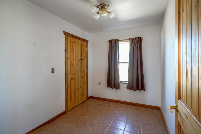 unfurnished room with ceiling fan