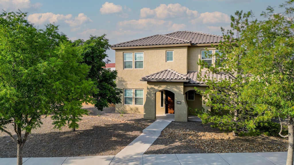 mediterranean / spanish-style home featuring a patio area