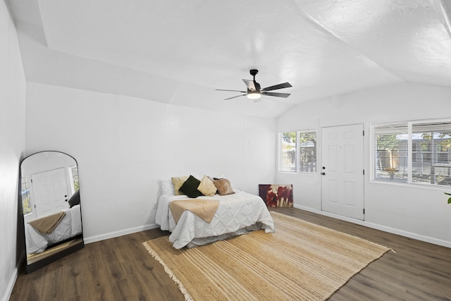 bedroom with vaulted ceiling, ceiling fan, and dark hardwood / wood-style floors