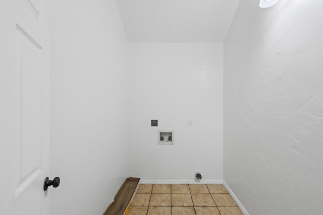 laundry area featuring light tile patterned floors, hookup for a washing machine, and electric dryer hookup