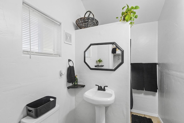 bathroom with sink and toilet