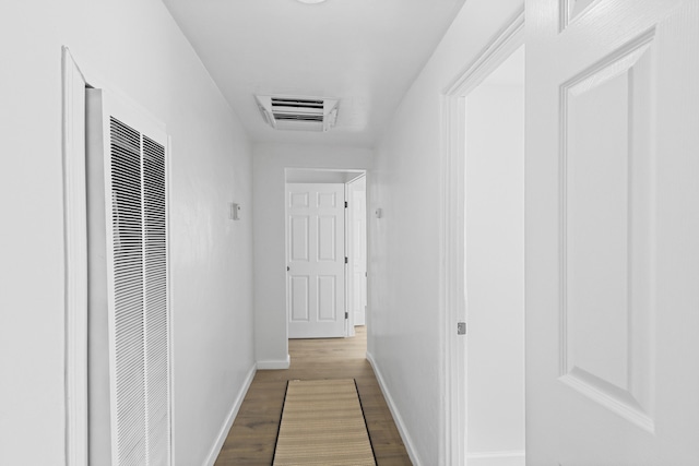 hallway featuring wood-type flooring