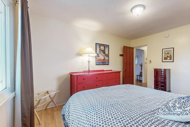 bedroom with wood-type flooring