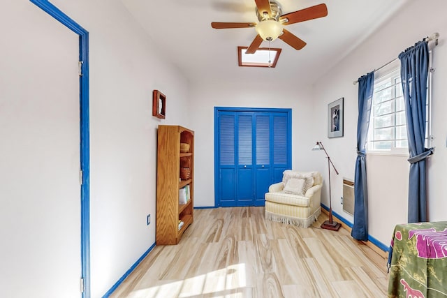 entryway with ceiling fan and light wood-type flooring