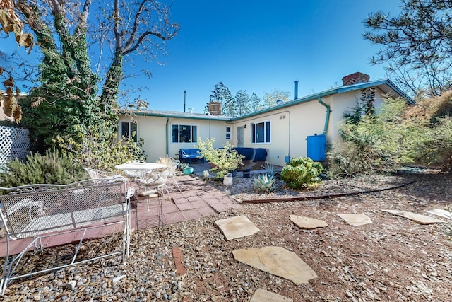 rear view of house featuring a patio area