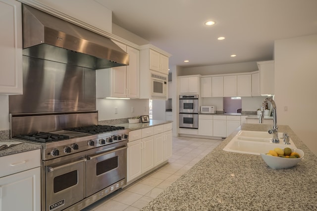 kitchen with white cabinetry, appliances with stainless steel finishes, and sink