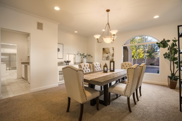 carpeted dining area with crown molding and a notable chandelier