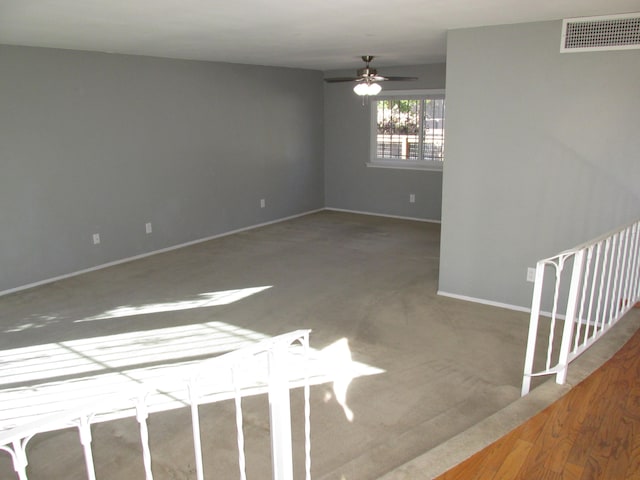 empty room featuring hardwood / wood-style flooring and ceiling fan