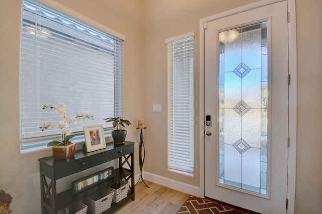 foyer entrance with light wood-type flooring