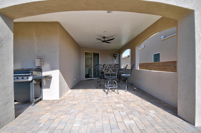 view of patio with ceiling fan and grilling area