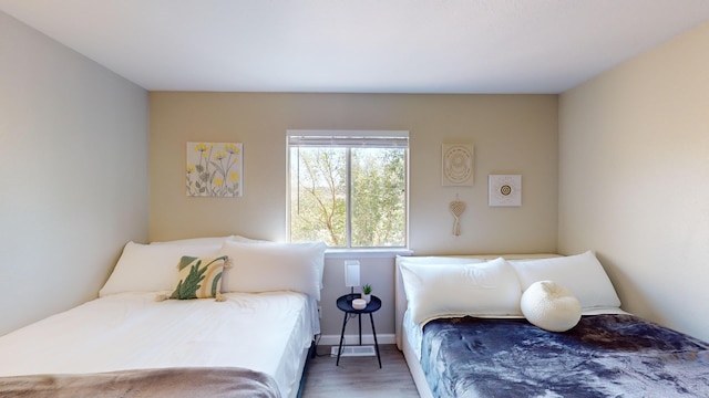 bedroom with dark wood-type flooring