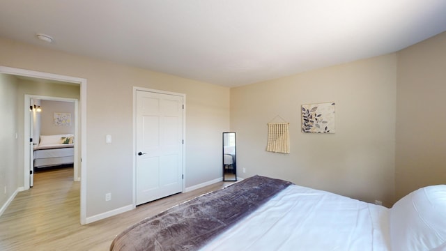 bedroom with light hardwood / wood-style flooring