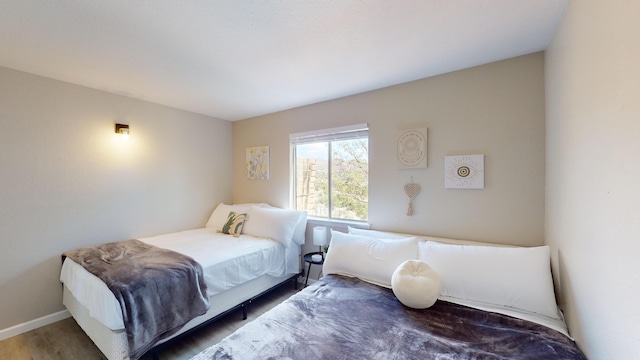 bedroom featuring hardwood / wood-style flooring