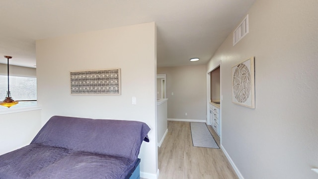 bedroom with light hardwood / wood-style floors