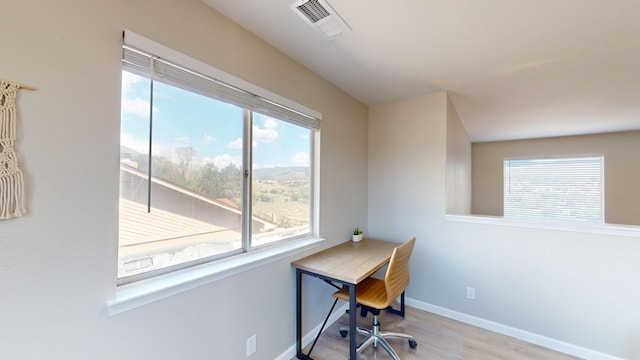 home office with light wood-type flooring