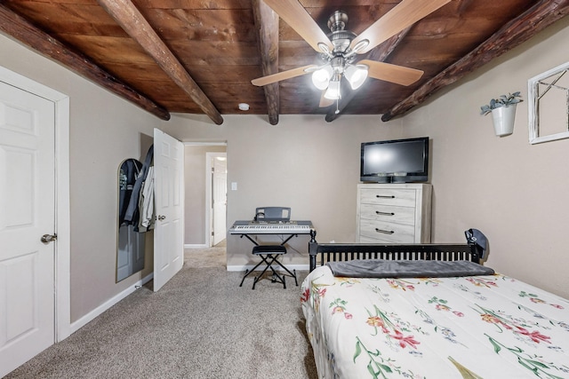 unfurnished bedroom with wood ceiling, beam ceiling, light carpet, and baseboards