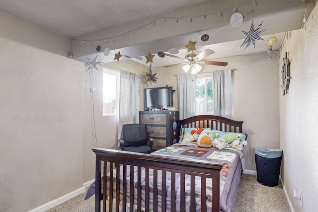 carpeted bedroom featuring ceiling fan and baseboards