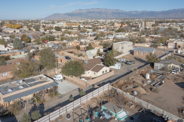 drone / aerial view featuring a residential view and a mountain view