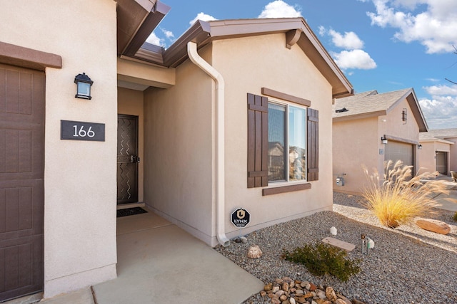 doorway to property featuring a garage