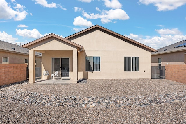 back of house with a patio area