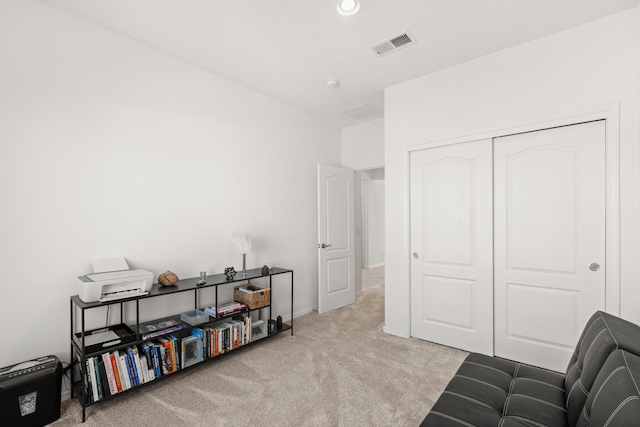 living area featuring light colored carpet