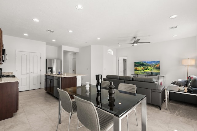 dining area with ceiling fan