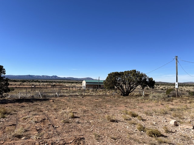 view of yard featuring a mountain view and a rural view