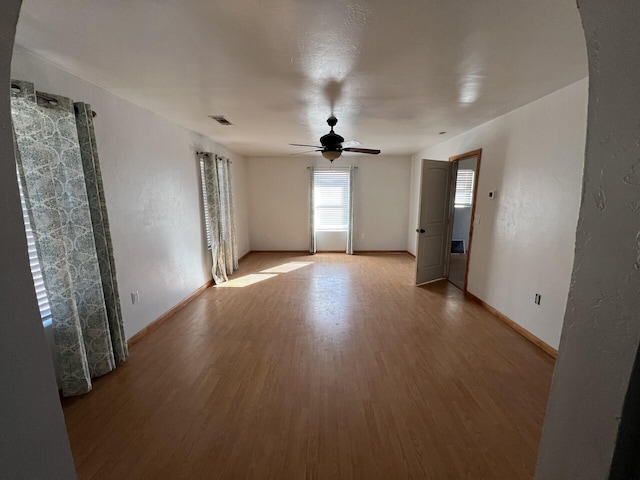 spare room featuring ceiling fan and light hardwood / wood-style floors