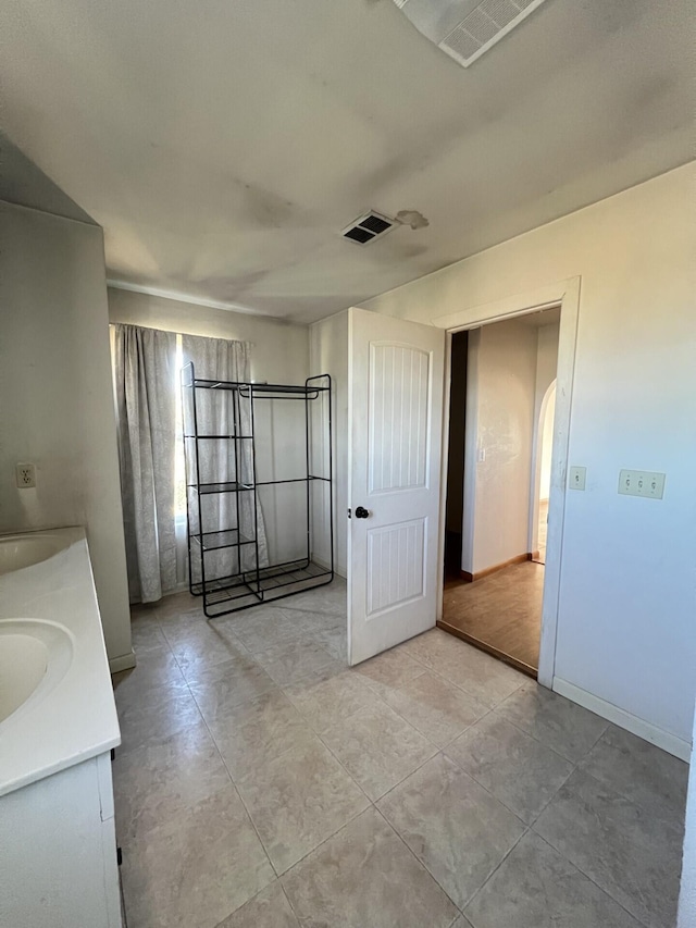 bathroom featuring vanity and wood-type flooring