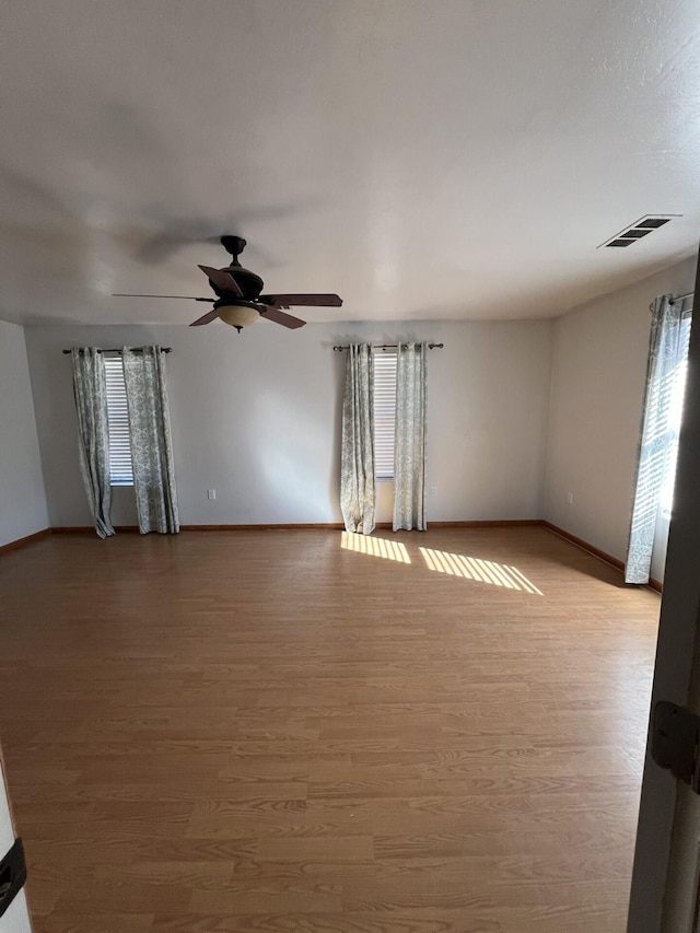 unfurnished room featuring ceiling fan and light hardwood / wood-style flooring