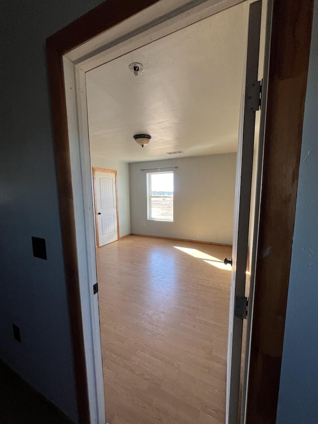 hallway featuring light wood-type flooring