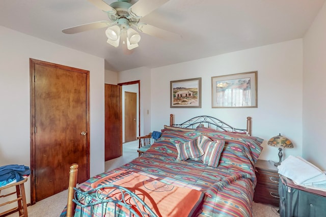 bedroom featuring ceiling fan and light carpet