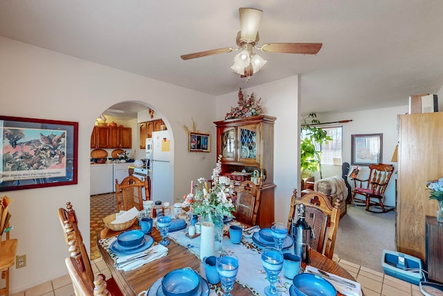 dining space with ceiling fan and light tile patterned floors