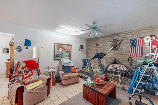 tiled living room with a textured ceiling and ceiling fan