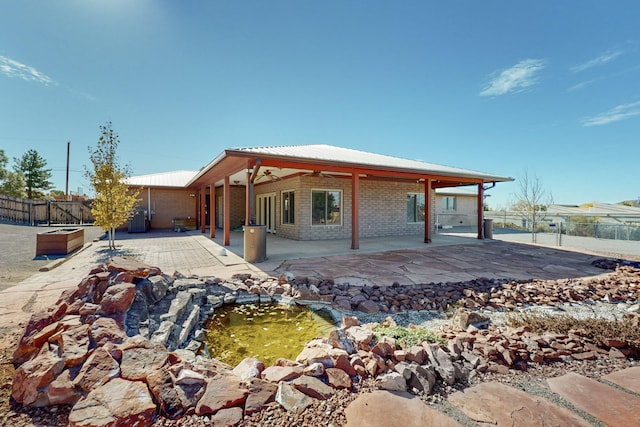 back of house featuring a patio area and ceiling fan