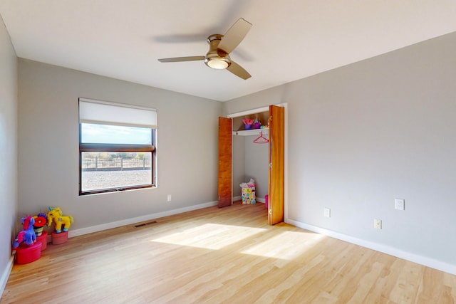 interior space featuring light hardwood / wood-style floors and ceiling fan