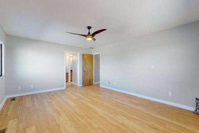 spare room featuring ceiling fan and light hardwood / wood-style flooring