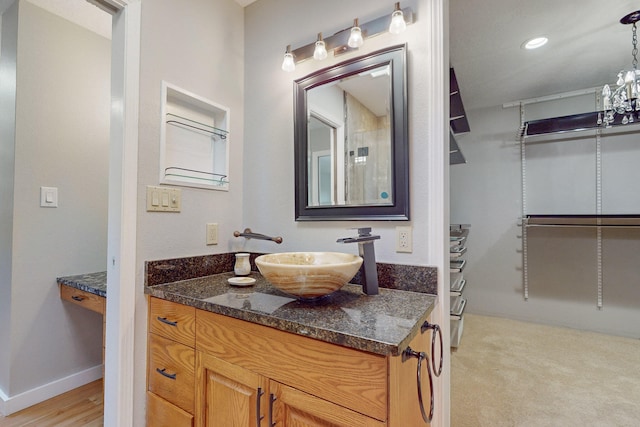 bathroom with vanity and wood-type flooring