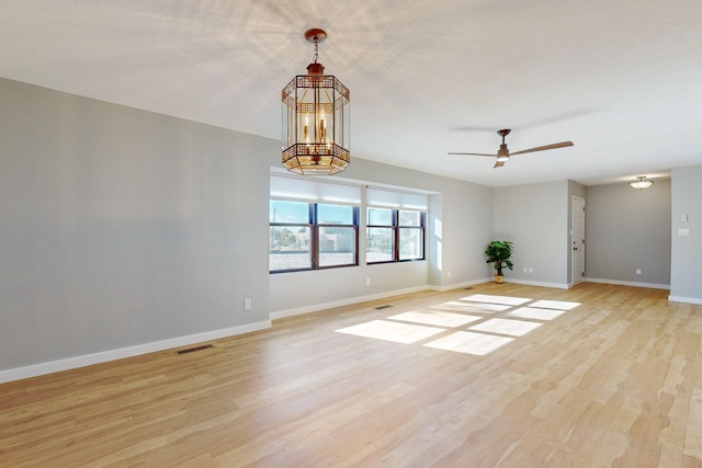 spare room with ceiling fan and light hardwood / wood-style flooring