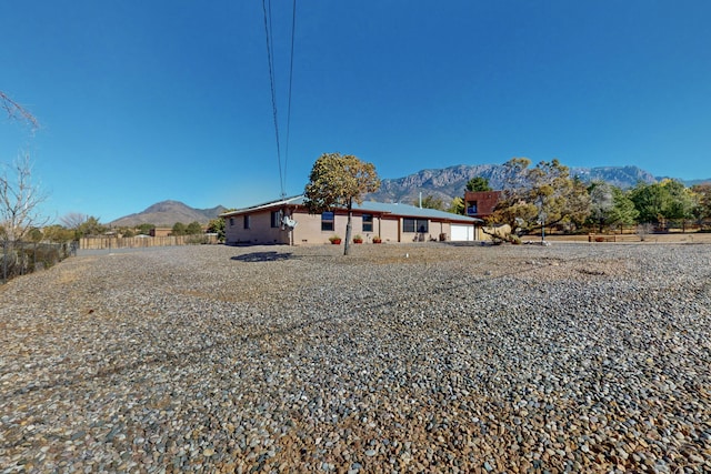 rear view of property featuring a mountain view