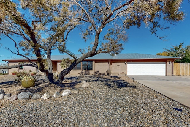 ranch-style house featuring a garage