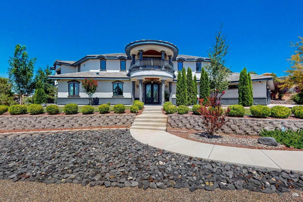 view of front of property with a balcony