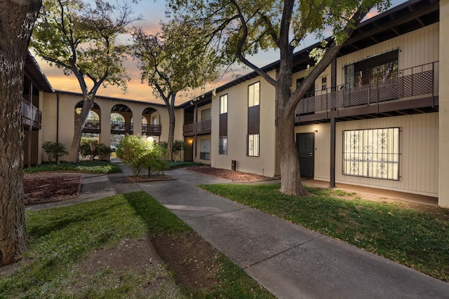 view of property's community with a lawn