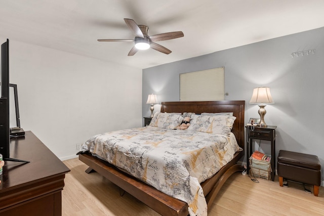 bedroom featuring ceiling fan and light hardwood / wood-style floors