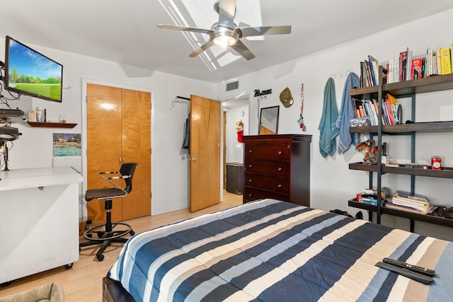 bedroom with ceiling fan and light hardwood / wood-style floors