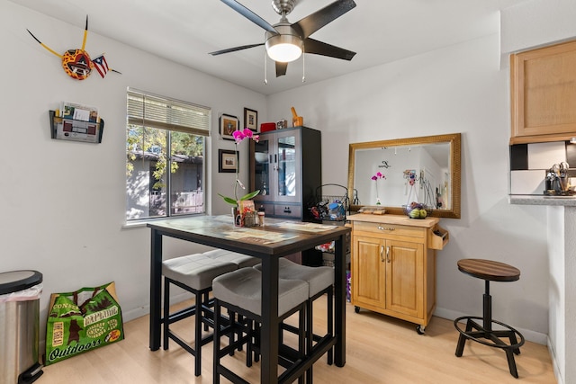 dining area featuring ceiling fan and light hardwood / wood-style flooring