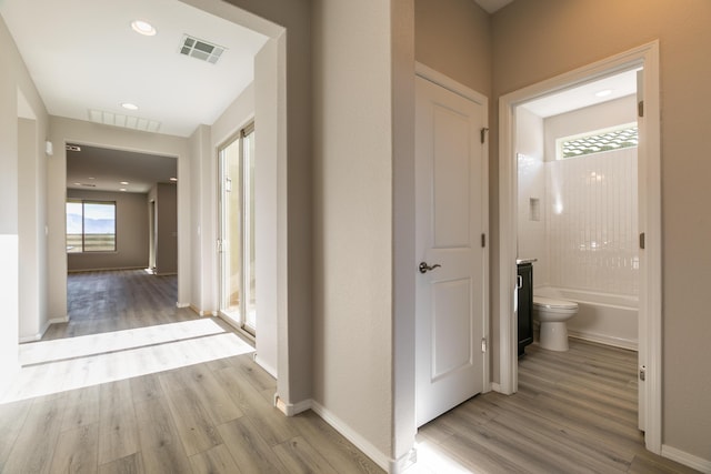 corridor featuring light hardwood / wood-style flooring